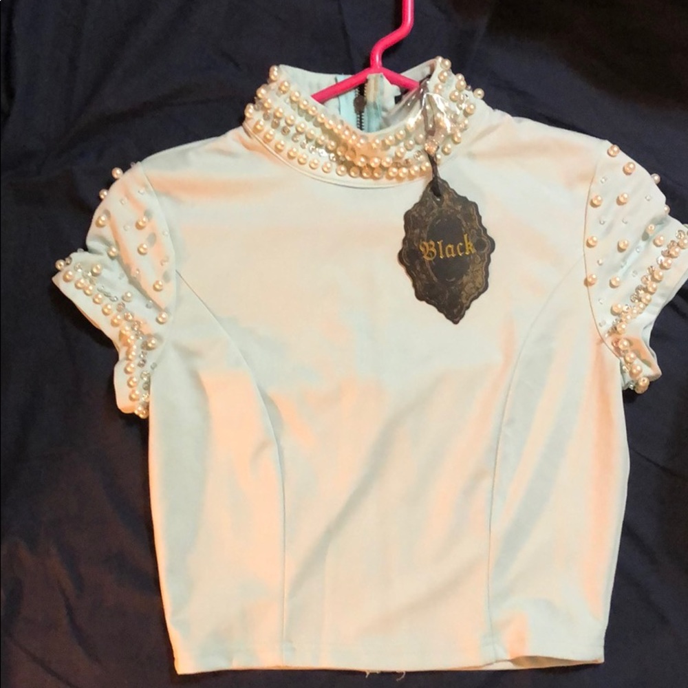 Fancy, short sleeve, zip up top with detailing